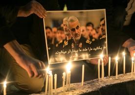 People light candles at a mourning ceremony for Qasem Soleimani in Tehran, January 2020 (Ahmad Halabisaz / Redux) 